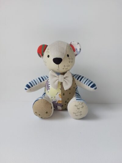 Small sized keepsake memory bear which has been handmade from babies first clothing items