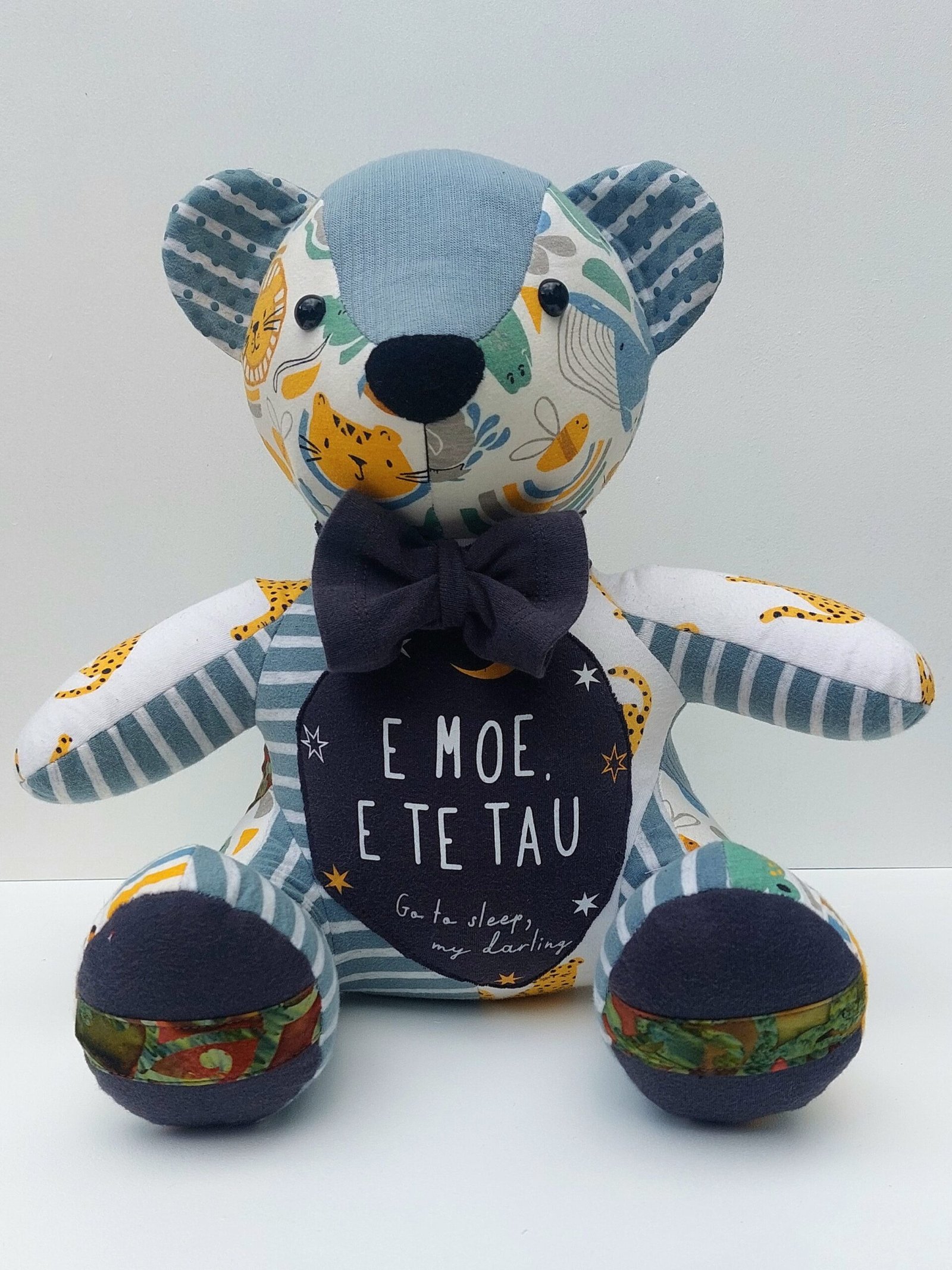 Memory Bear made from babies clothing with Maori writing on the front