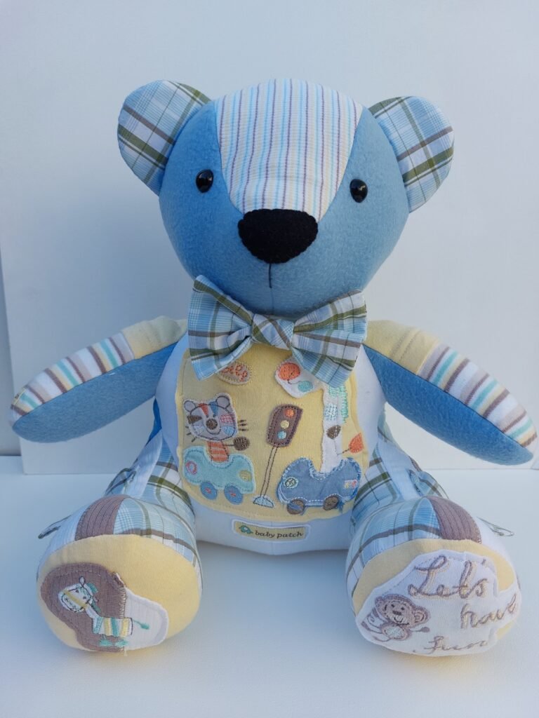 Keepsake bear made from babies clothes in neural colours