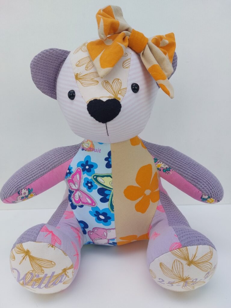 Baby keepsake memory bear with her date of birth and used the babies clothing to handmake