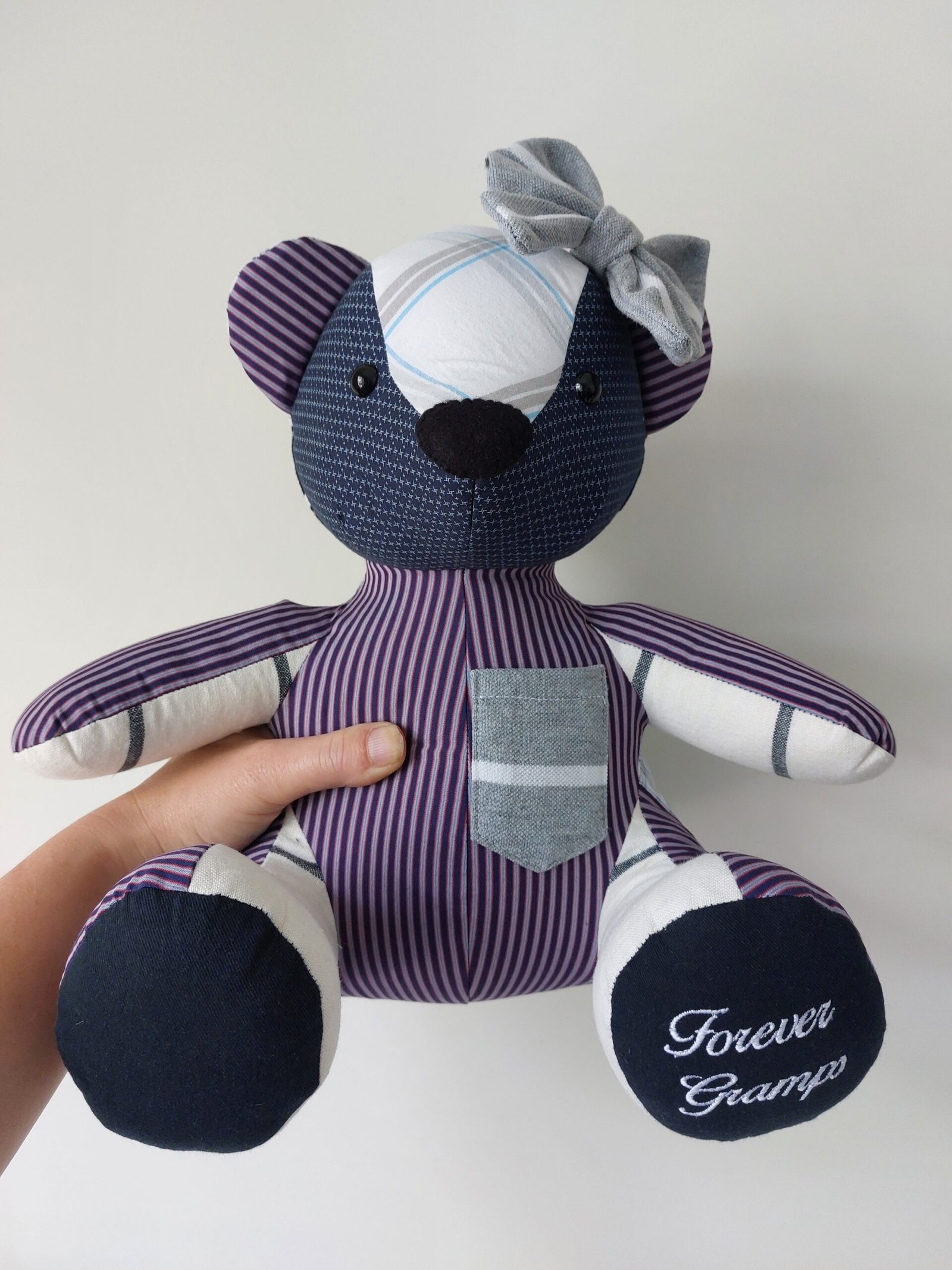 holding a memory bear to show the finished result